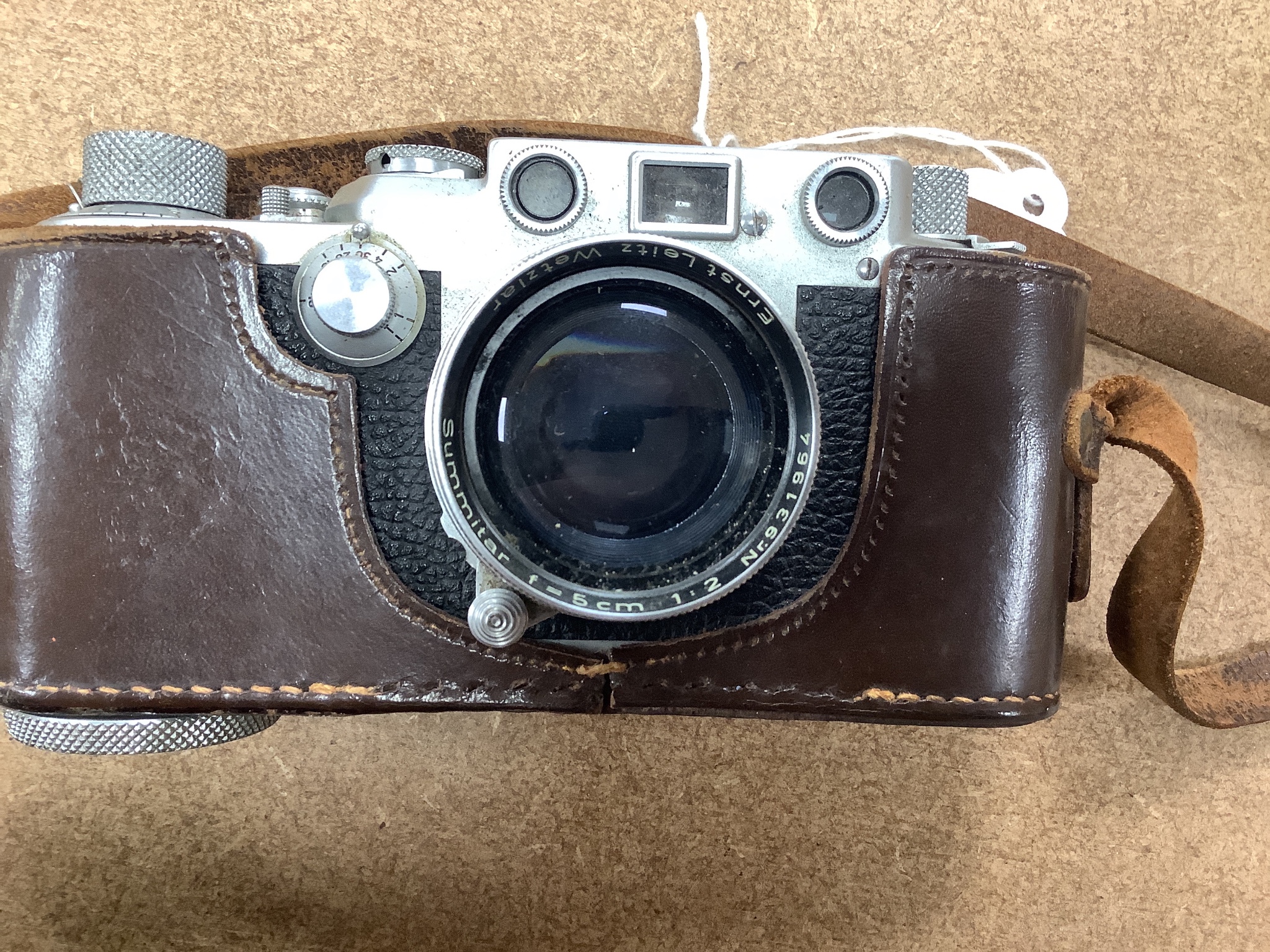 A cased Leica Ernst Leitz Wetzlar nr. 606583 camera together with light meter, lenses etc.